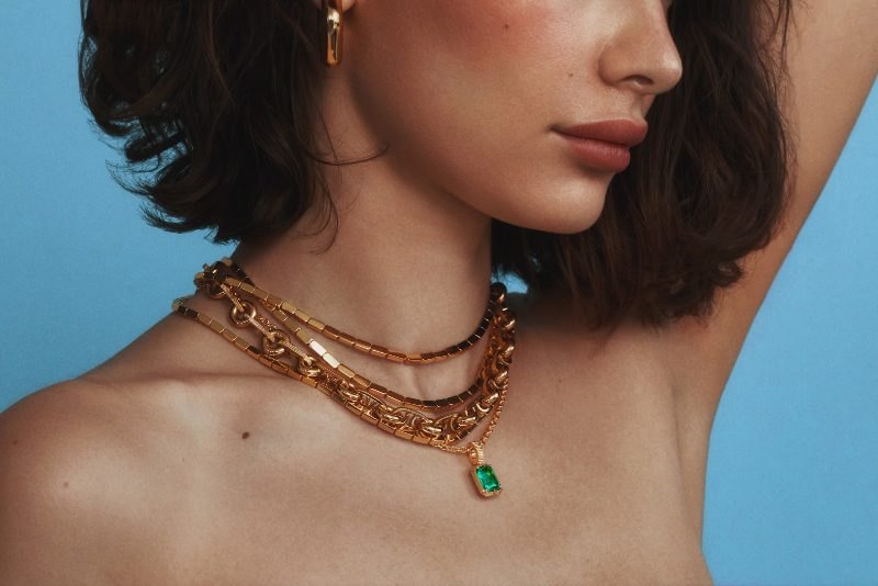 The Kathryn pendant layered with gold chains